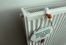 a radiator with a sign attached to it