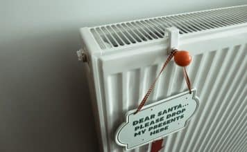 a radiator with a sign attached to it