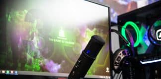 black microphone beside black flat screen computer monitor