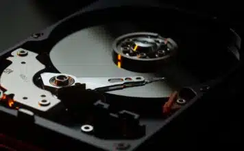 black and silver turntable on brown wooden table